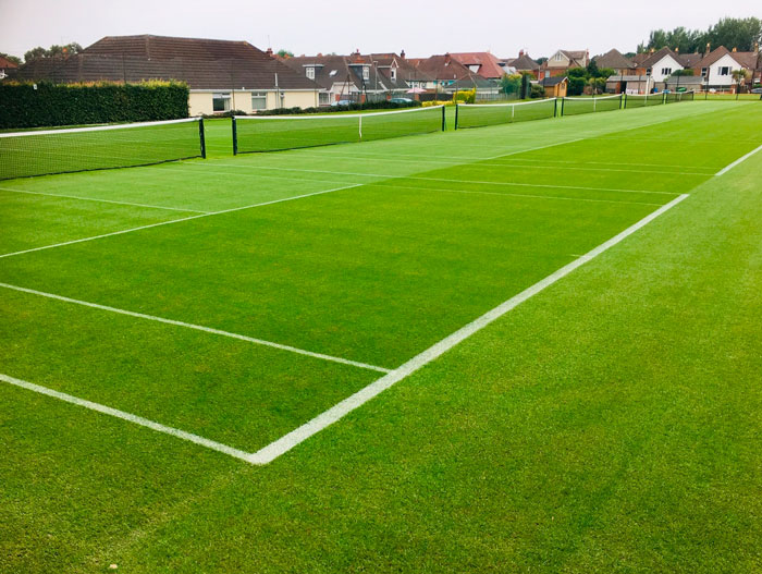 East Dorset Tennis Club tennis courts on vibrant green grass